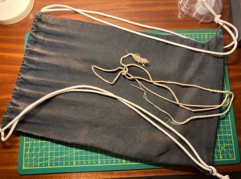 drawstring tote with new ropes, old ropes laid ontop