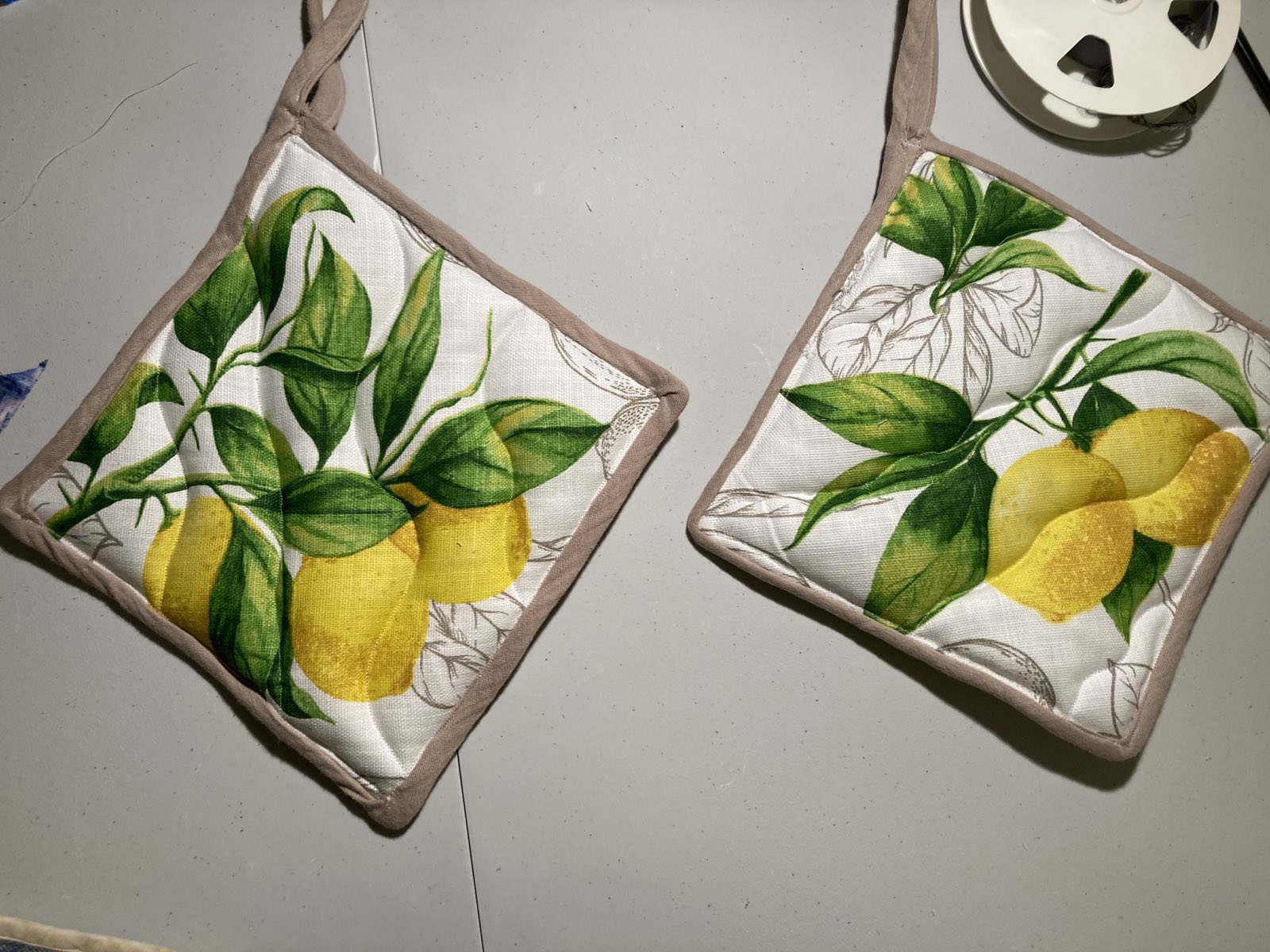 two oven pads with lemon motif
